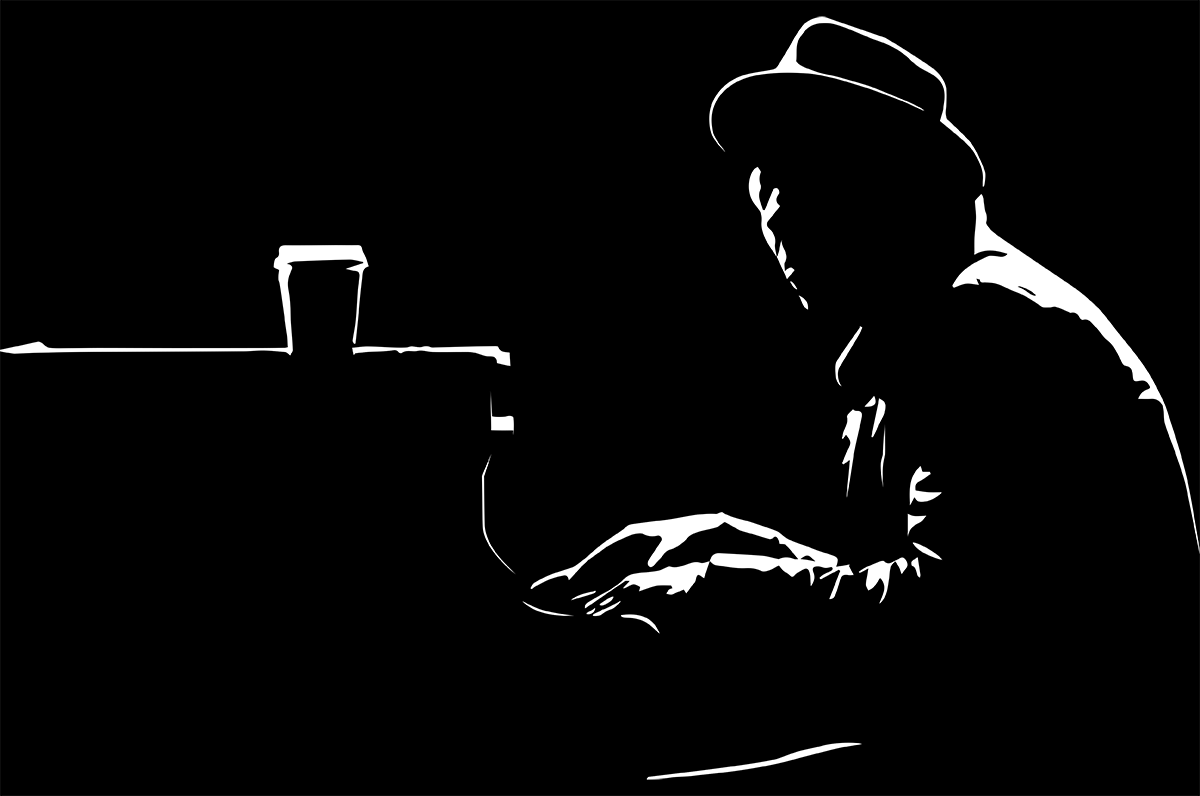 silouette of man playing piano